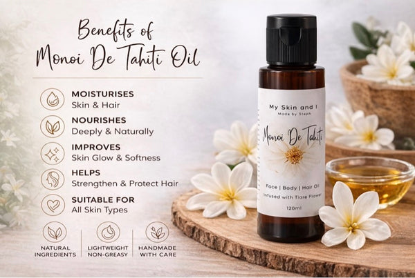 Monoi De Tahiti oil bottle with benefits listed on a wooden surface with flowers.