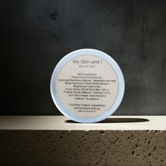 Cosmetic container with label on a textured surface and dark background