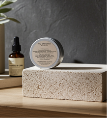 Skincare products on a wooden surface with a plant in the background
