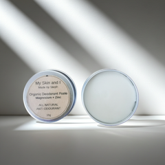 Two containers of organic deodorant paste on a light background
