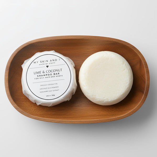 Two shampoo bars on a wooden tray with a white background